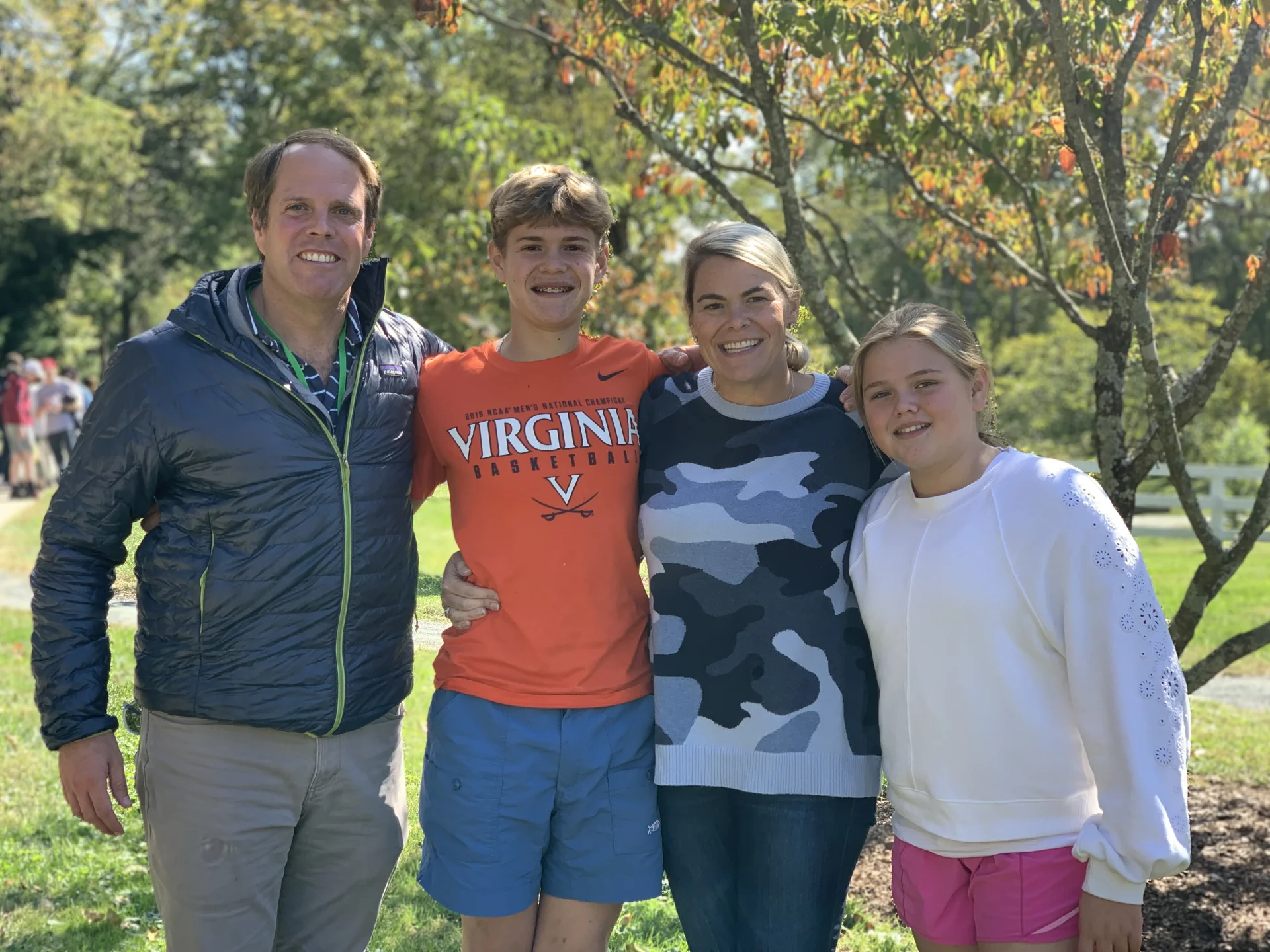 parents, sibling, and student smiling